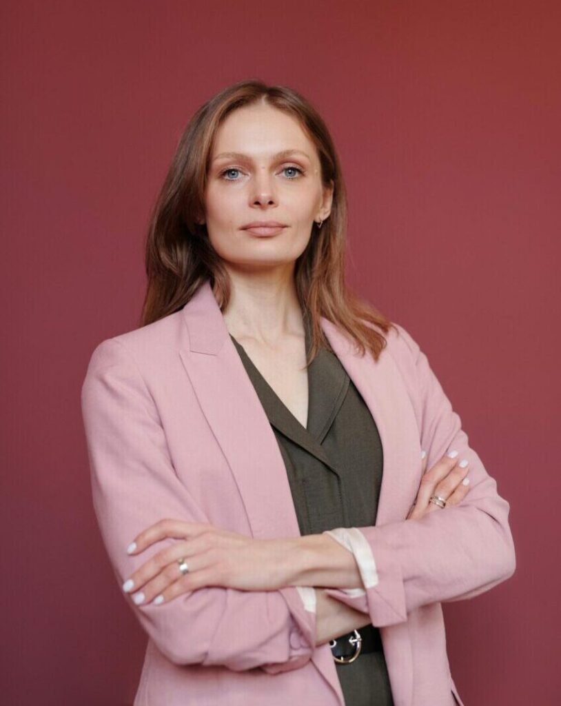 About Elegant businesswoman with arms crossed in studio portrait, showcasing leadership and confidence.